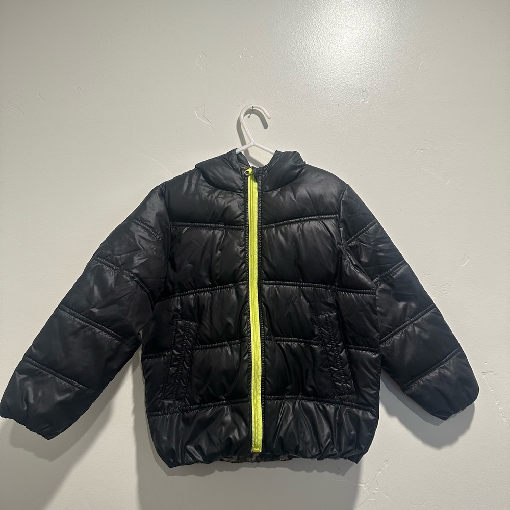 Onekid puffy jacket, size 4/5 , black and neon green zipper.